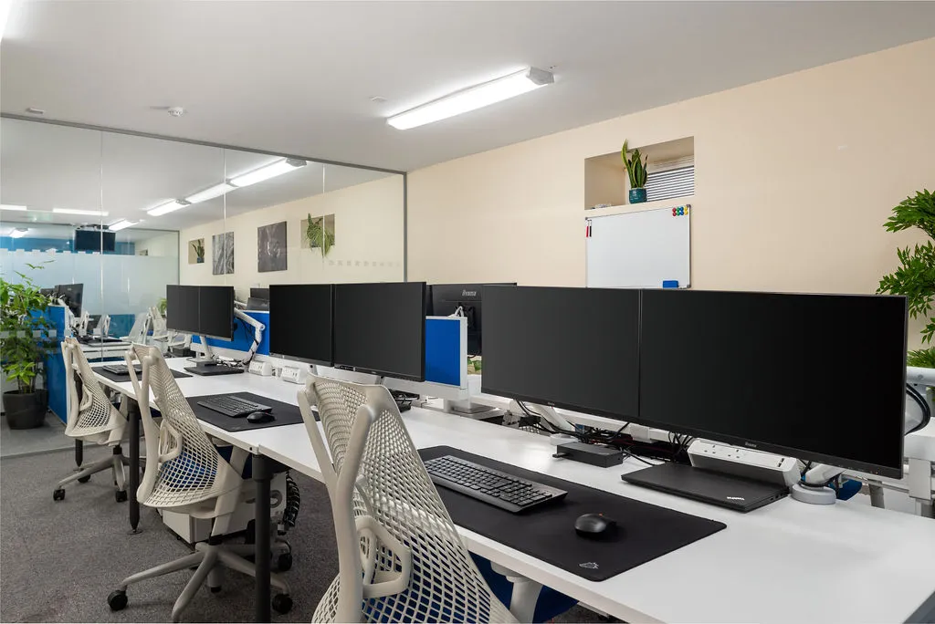 neat office space with matching tech